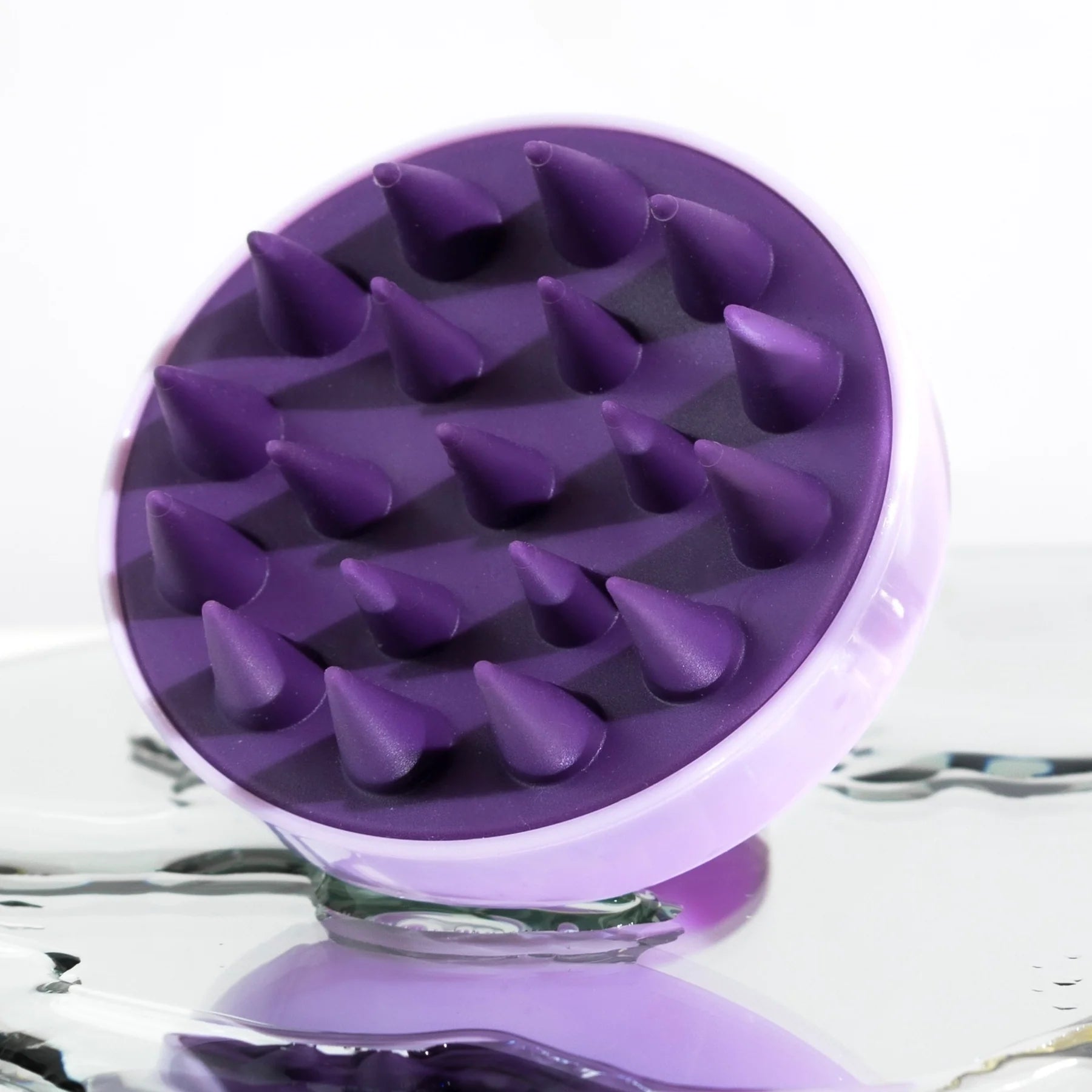 Scalp massager with soft silicone bristles to stimulate circulation and promote hair growth
